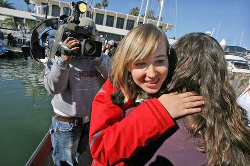 Abby hugging her mother just before departure © Lisa Gizara 2009 Gizaraarts.Com